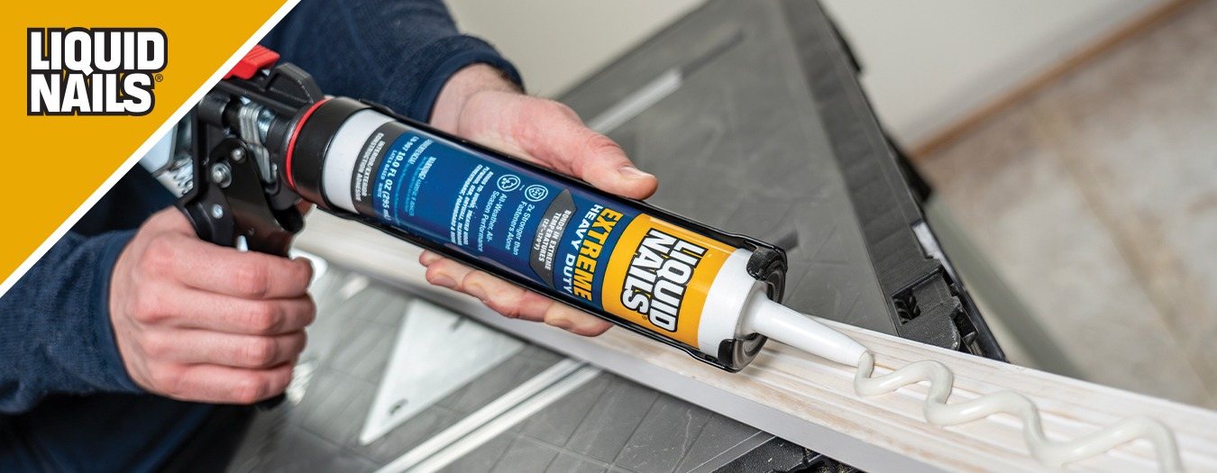 Liquid Nails Extreme Heavy Duty cartridge in a caulk gun with the brand logo