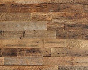 Reclaimed wood wall paneling installed with construction adhesive